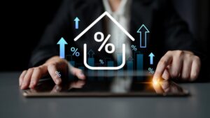 Businessman interacts with tablet, analyzing financial data represented by graphs and percent signs. Focus on growth, success, and modern technology in professional environment.