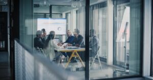 Business team reviewing operational data during a meeting to identify recurring process issues.